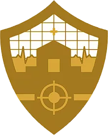 A gold shield-shaped emblem features a medical cross, a hospital building, and cardiogram lines. Below these elements, there is a target-like symbol, evoking precision. The background suggests a grid or window pattern, reminiscent of home. The design likely represents a blend of healthcare and targeted care.