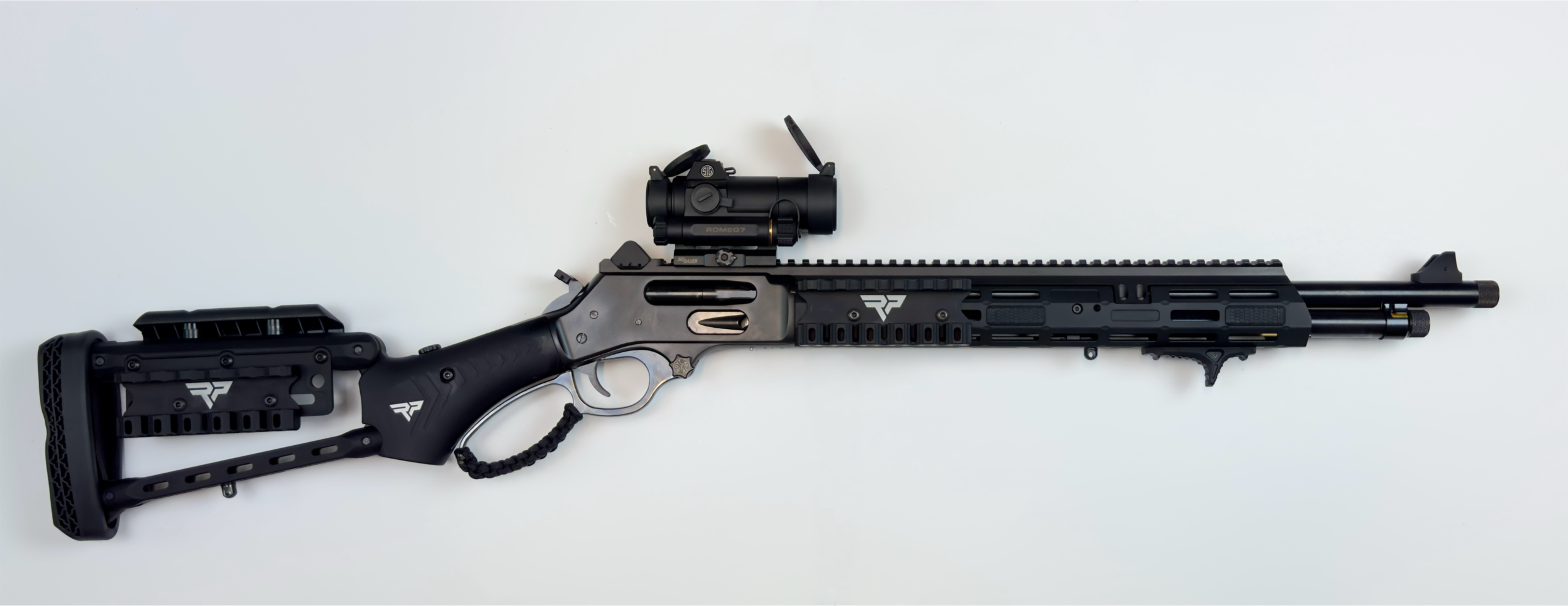 The FIF-XR 45-70, a custom Henry X Tactical Lever Action Rifle, boasts a sleek black and silver finish. This modern-design firearm is equipped with an optic sight on top, multiple mounting rails, and an adjustable stock, offering various attachments for enhanced functionality.